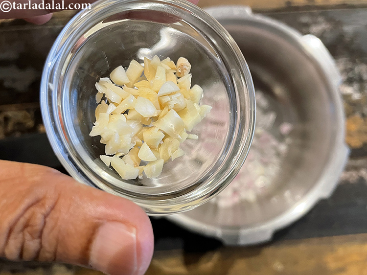 Step 19 – Add&nbsp;<meta charset="UTF-8" />3&nbsp;<a href="glossary-garlic-cloves-1857i">garlic (lehsun) cloves</a>, roughly chopped.&nbsp;Garlic&nbsp;has been proven to&nbsp;<a href="https://www.tarladalal.com/recipes-for-Low-Cholesterol--380">lower cholesterol</a>.&nbsp;The active ingredient …