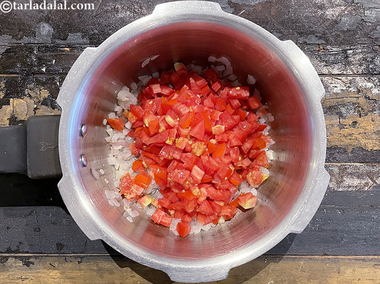 Step 21 – Add&nbsp;<meta charset="UTF-8" />1 1/2 cups&nbsp;finely&nbsp;<a href="glossary-chopped-tomatoes-779i">chopped tomatoes</a>.&nbsp;Tomatoes&nbsp;are extremely rich source of&nbsp;<a href="https://www.tarladalal.com/recipes-for-Lycopene-Diet-1175">Lycopene</a>. Tomatoes are a …
