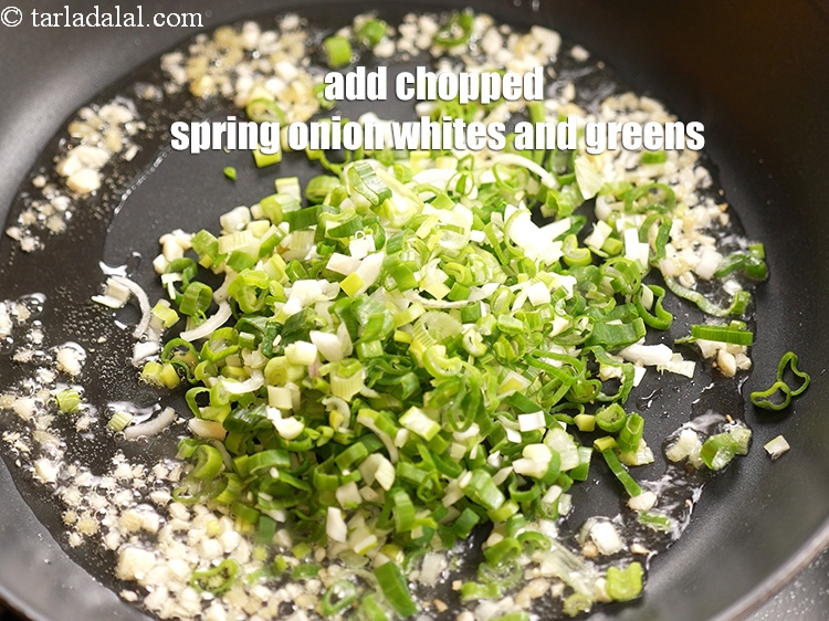 Step 10 – Add &frac34; cup&nbsp;<a href="https://www.tarladalal.com/glossary-chopped-spring-onion-whites-815i">chopped spring onion whites</a>&nbsp;and&nbsp;<a href="https://www.tarladalal.com/glossary-chopped-spring-onion-greens-1030i">greens</a>.