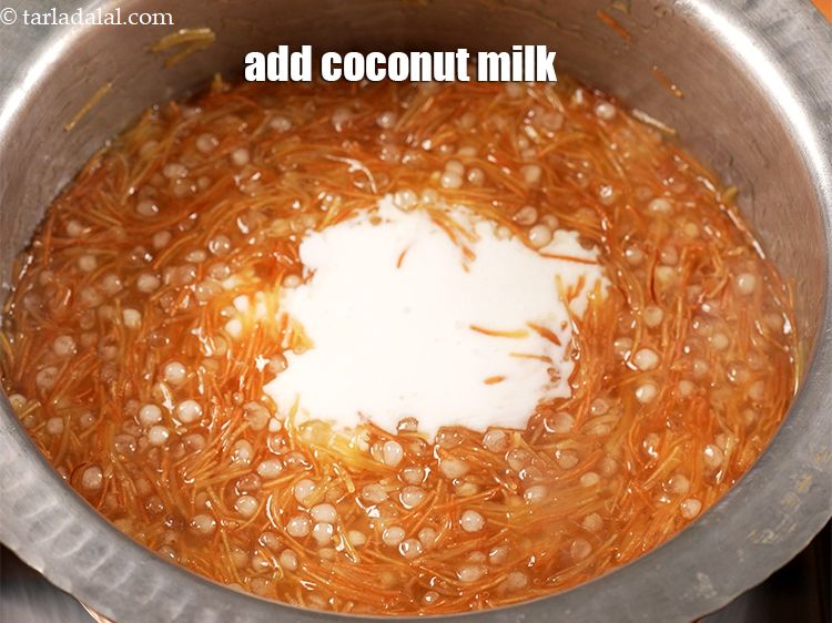 Step 10 – Add 1 cup <a href="https://www.tarladalal.com/glossary-coconut-milk-nariyal-ka-doodh-861i">coconut milk (nariyal ka doodh)</a>.