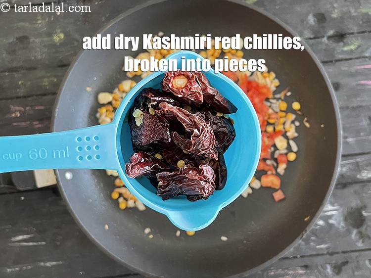 Step 39 – Add&nbsp;5 dried kashmiri red chilli, broken into pieces.