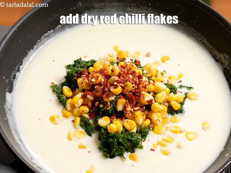 Step 10 – Add 1 tsp <a href="https://www.tarladalal.com/glossary-dry-red-chilli-flakes-paprika-338i">dry red chilli flakes (paprika)</a>.