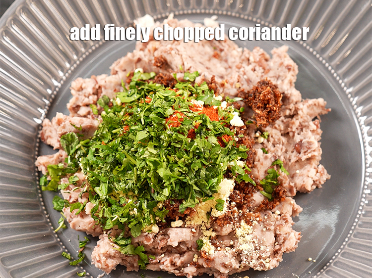 Step 14 – Add 2 tbsp finely <a href="https://www.tarladalal.com/glossary-chopped-coriander-783i">chopped coriander (dhania)</a>.