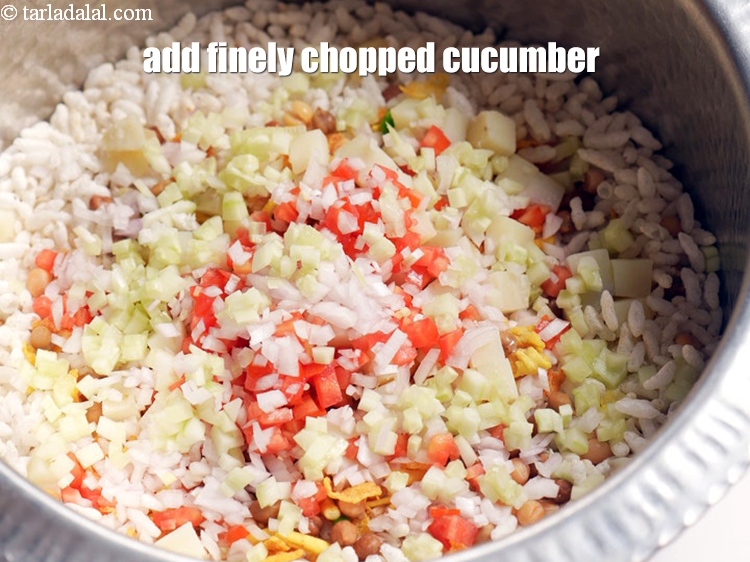 Step 11 – Add &frac12; cup finely&nbsp;<a href="https://www.tarladalal.com/glossary-chopped-cucumber-795i">chopped cucumber</a>.