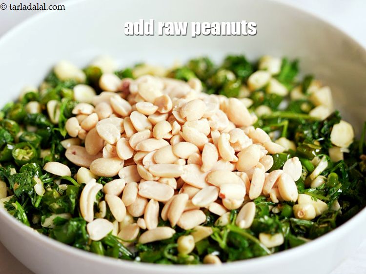 Step 10 – Once cooled, add 6 tbsp&nbsp;<a href="https://www.tarladalal.com/glossary-raw-peanuts-kachi-mungfali-kachi-moongfali-847i">raw peanuts</a>.&nbsp;