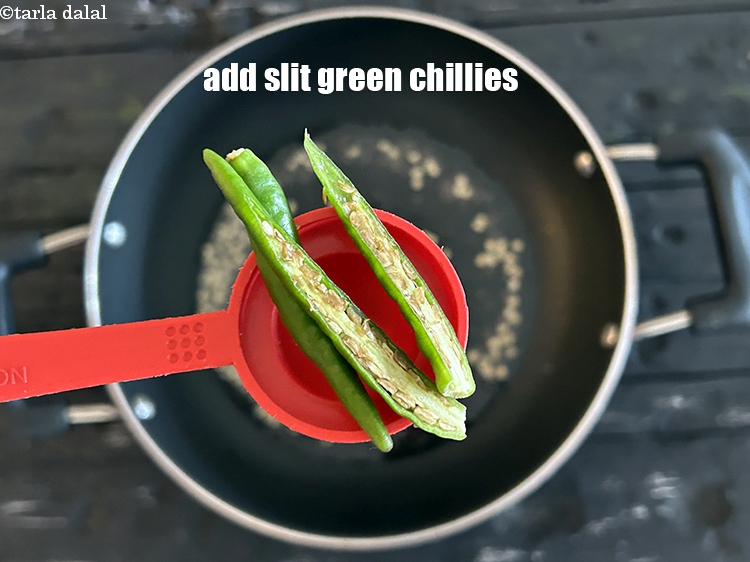 Step 16 – <html><head></head><body><p>Add&nbsp;1 to 2&nbsp;<a href="glossary-green-chillies-hari-mirch-331i">green chillies</a>&nbsp;,&nbsp;<a href="glossary-slit-green-chillies-1856i">slit green chillies</a>&nbsp;lengthwise.</p></body></html>