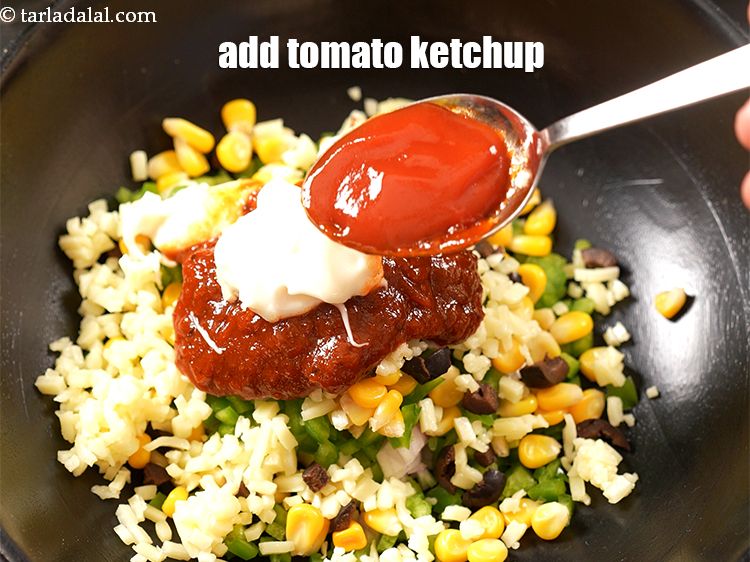 Step 10 – Add 1 tbsp <a href="https://www.tarladalal.com/glossary-tomato-ketchup-tomato-sauce-181i">tomato ketchup</a>.