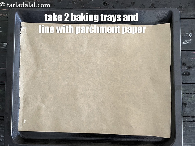 Step 17 – Take a baking tray and line with parchment paper.
