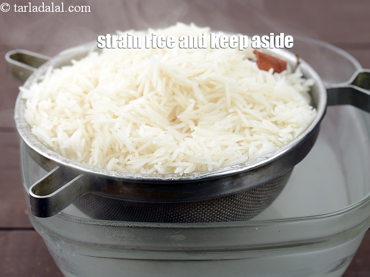 Step 14 – Strain the rice using a strainer, discard the water&nbsp;and keep aside.