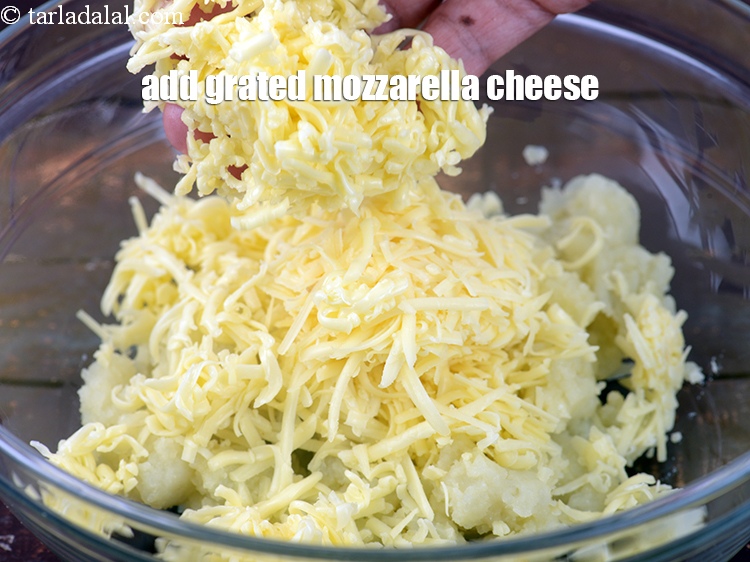 Step 10 – Add 1/2 cup <a href="https://www.tarladalal.com/glossary-grated-mozzarella-cheese-1022i">grated mozzarella cheese</a>.
