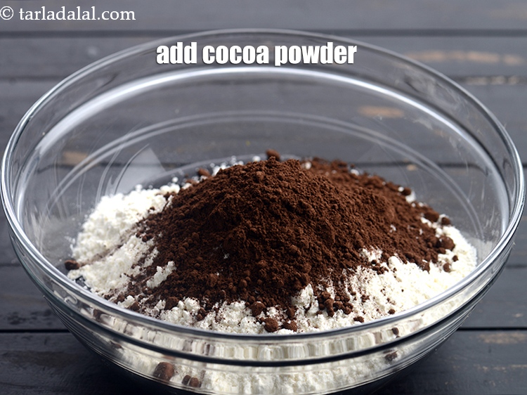 Step 10 – Add &frac14; cup <a href="https://www.tarladalal.com/glossary-cocoa-powder-284i">cocoa powder</a>.