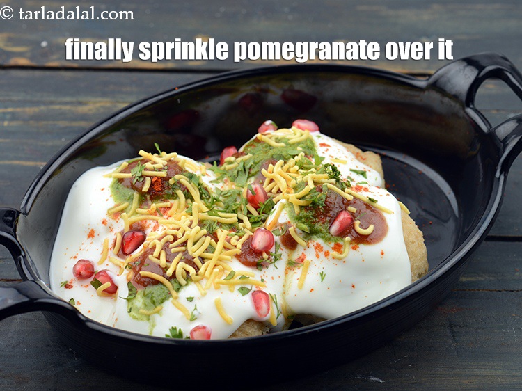 Step 70 – Finally sprinkle 1 tbsp <a href="https://www.tarladalal.com/glossary-pomegranate-anar-587i">pomegranate (anar)</a>&nbsp;evenly over it.