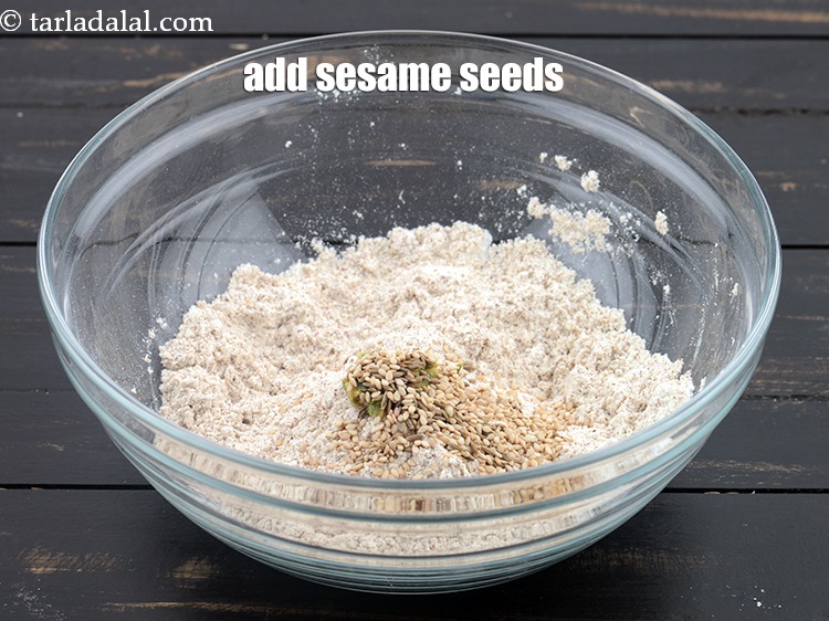 Step 10 – Add 1/2 tsp&nbsp;<a href="https://www.tarladalal.com/glossary-sesame-seeds-til-gingelly-seeds-612i">sesame seeds (til)</a>.