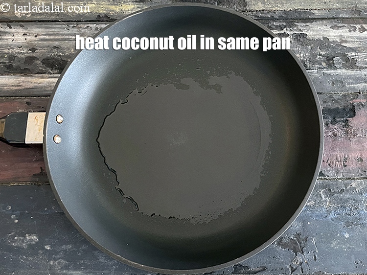 Step 10 – Heat 1 tsp&nbsp;<a href="glossary-coconut-oil-nariyal-ka-tel-1186i">coconut oil</a>&nbsp;in the same pan.