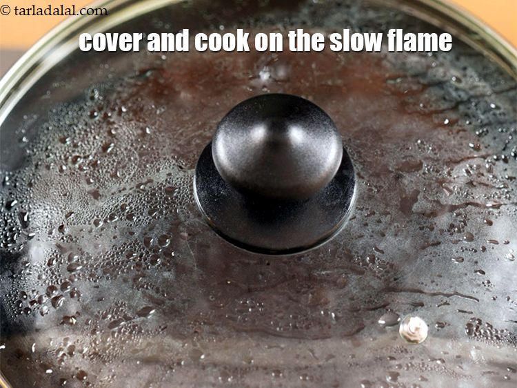 Step 10 – Cover and let the cake cook on the slow flame for 12-15 minutes.