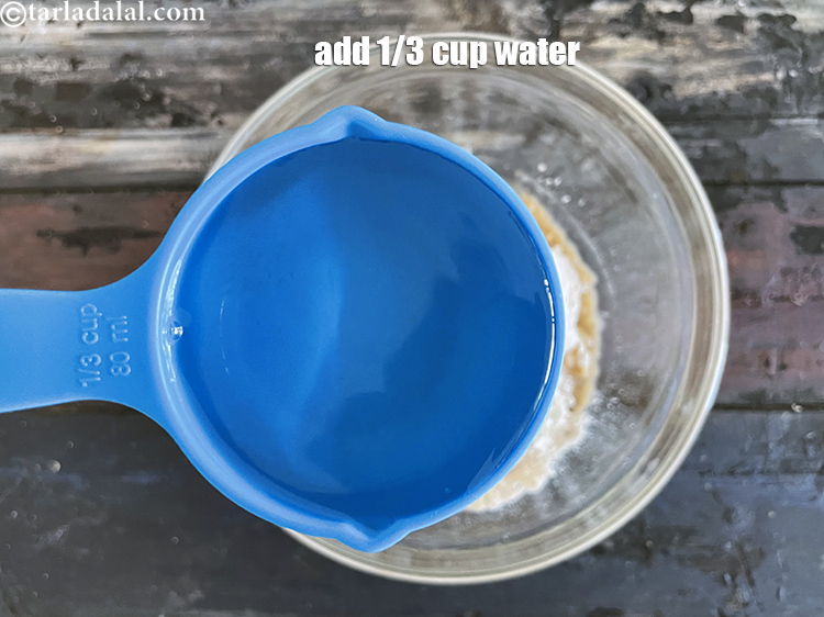 Step 10 – Add enough water to make a stiff dough. We used 1/3rd cup water.