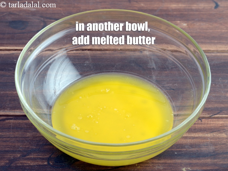 Step 12 – In another bowl, add &frac12; cup <a href="https://www.tarladalal.com/glossary-melted-butter-1941i">melted butter</a>.