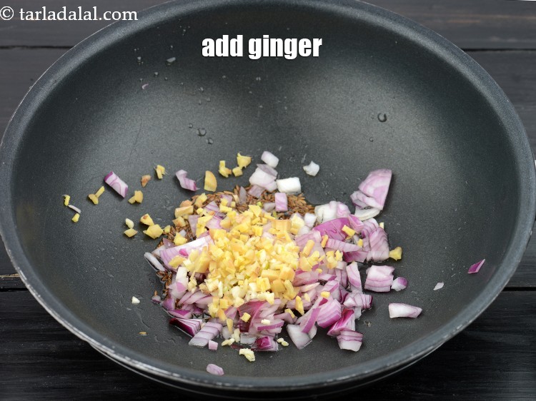 Step 10 – Add 2 tsp&nbsp;<a href="https://www.tarladalal.com/glossary-chopped-ginger-786i">chopped ginger (adrak)</a>.&nbsp;