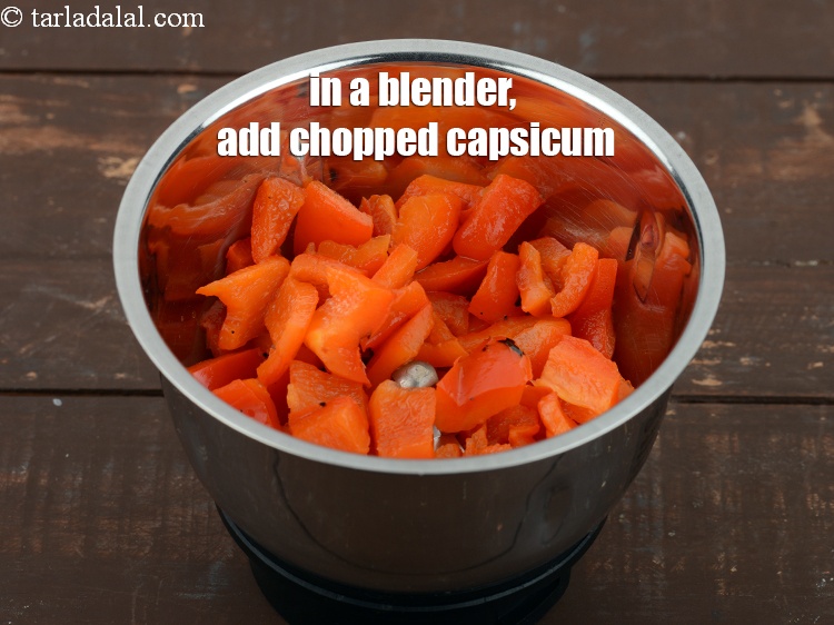 Step 10 – In a blender, add roasted and chopped capsicum.