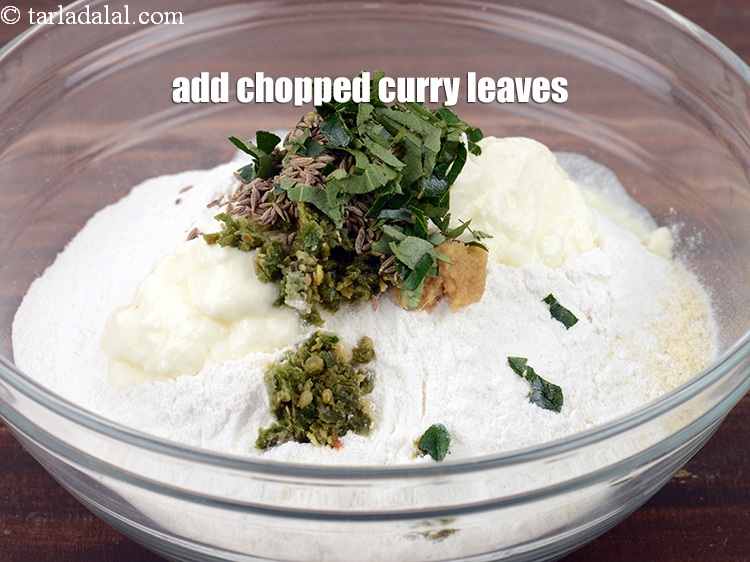 Step 10 – Add &frac12; tbsp <a href="https://www.tarladalal.com/glossary-chopped-curry-leaves-794i">chopped curry leaves (kadi patta)</a>.