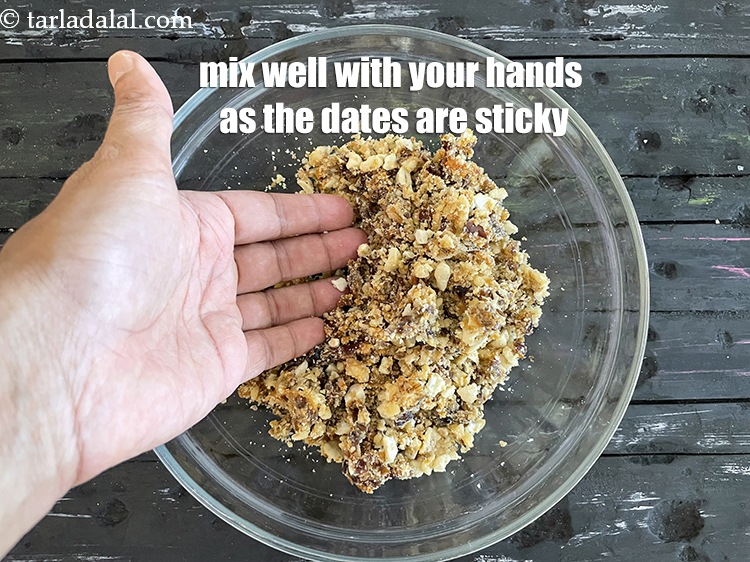 Step 19 – Mix the date cashew walnut mixture with your hands. You will not be able to …