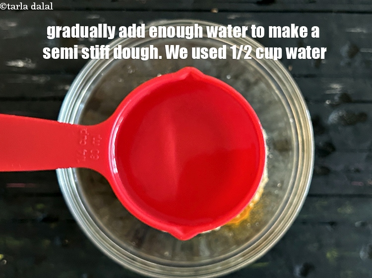 Step 11 – Gradullay add enough water to make a semi stiff dough. We added 1/2 cup&nbsp;water.
