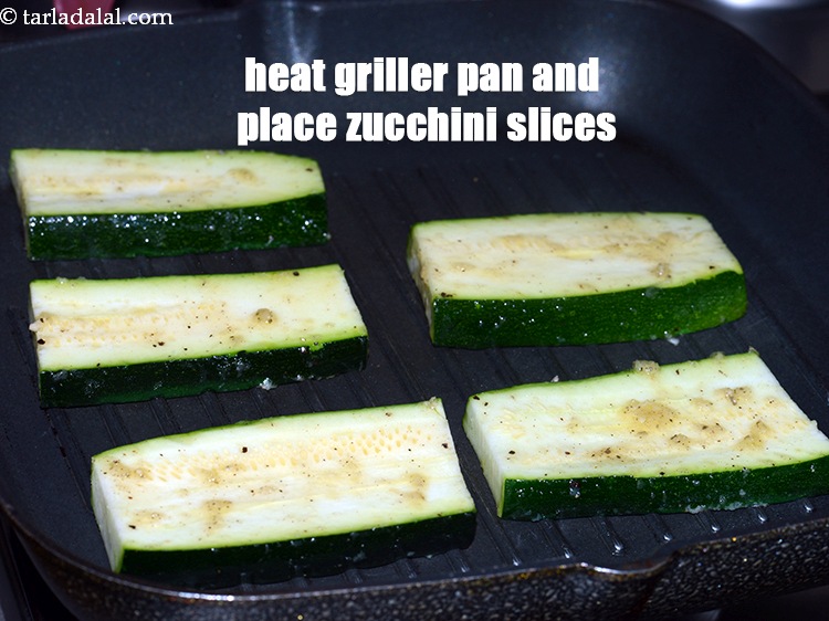 Step 10 – Heat a griller pan and place 5 marinated&nbsp;zucchini slices on it.
