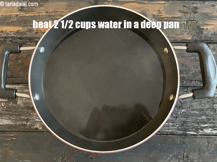 Step 10 – Heat 2&frac12; cups of water&nbsp;in a deep non-stick pan.
