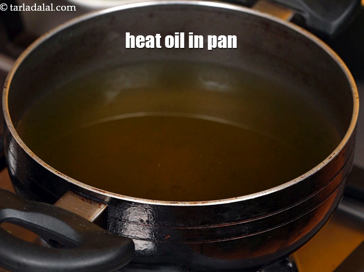 Step 10 – Heat the oil in a deep non-stick pan.