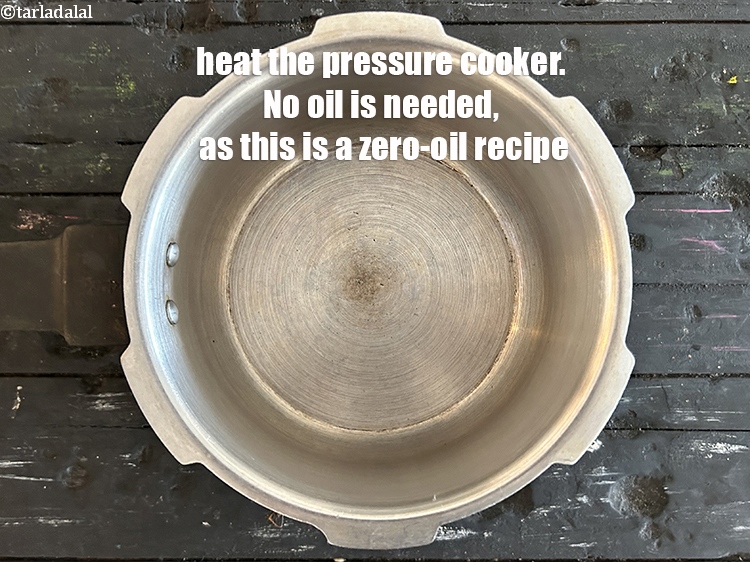 Step 12 – <p>Heat the pressure cooker.&nbsp;<strong>No oil is needed, as this is a zero-oil recipe.</strong> &nbsp;</p>