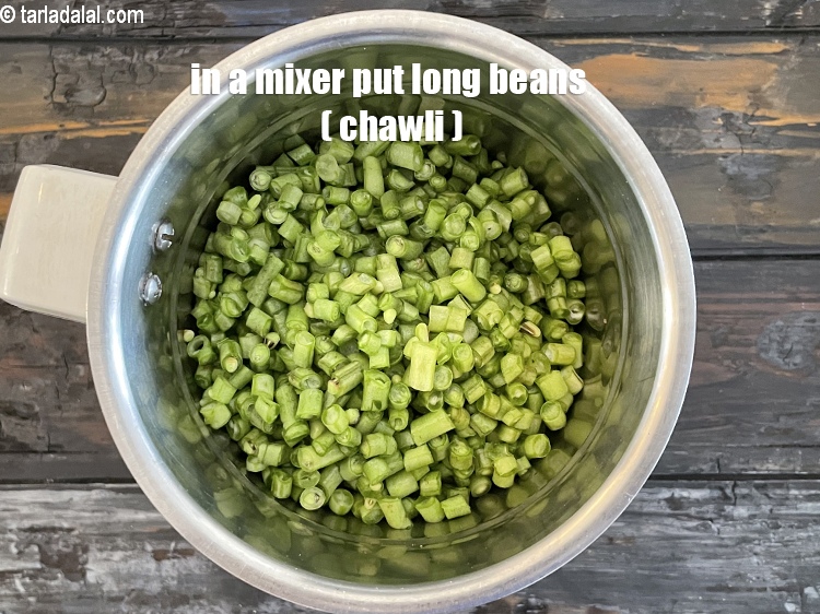 Step 11 – In a mixer put&nbsp;<meta charset="UTF-8" />2 cups&nbsp;finely&nbsp;<a href="glossary-chopped-long-beans-2343i">chopped long beans (chawli bhaji)</a>.