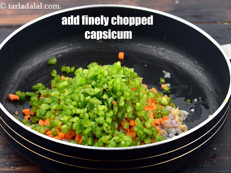 Step 10 – Add 1/2 cup&nbsp;finely&nbsp;<a href="https://www.tarladalal.com/glossary-chopped-capsicum-164i">chopped green capsicum</a>.