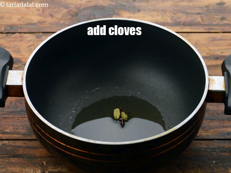 Step 9 – Add&nbsp;2&nbsp;<a href="https://www.tarladalal.com/glossary-cloves-laung-lavang-322i">cloves (laung / lavang)</a>.&nbsp;