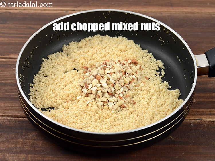 Step 12 – Add &frac14; cup <a href="https://www.tarladalal.com/glossary-chopped-mixed-nuts-928i">chopped mixed nuts</a>.