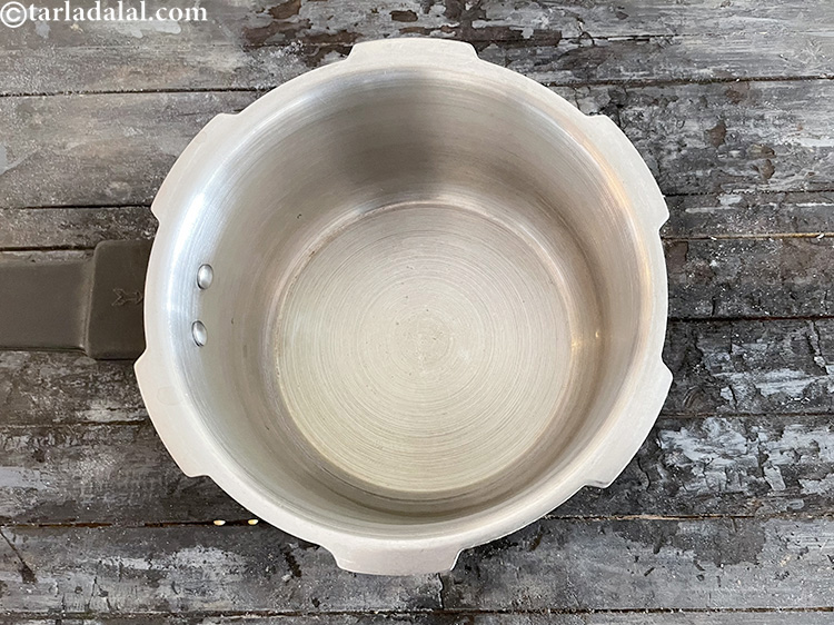 Step 18 – Heat 1 tbsp oil in a pressure cooker.