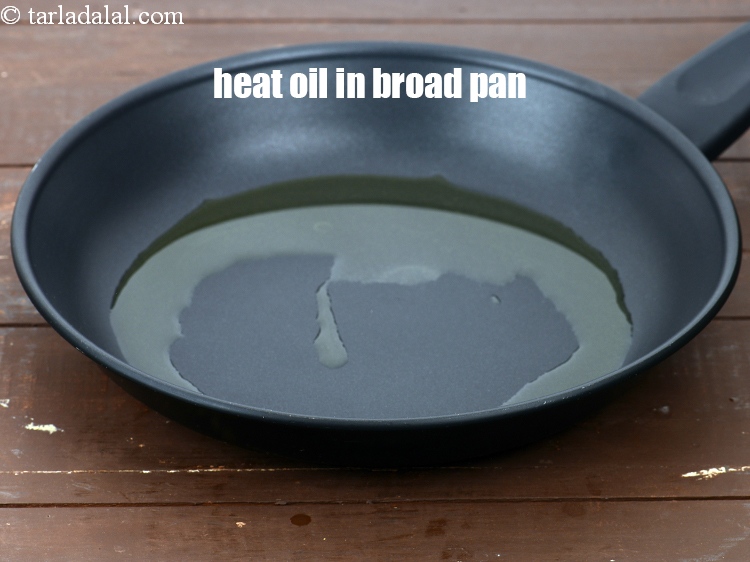 Step 10 – Heat 3 tbsp&nbsp;<a href="https://www.tarladalal.com/glossary-oil-671i">oil</a>&nbsp;in a broad non-stick pan.