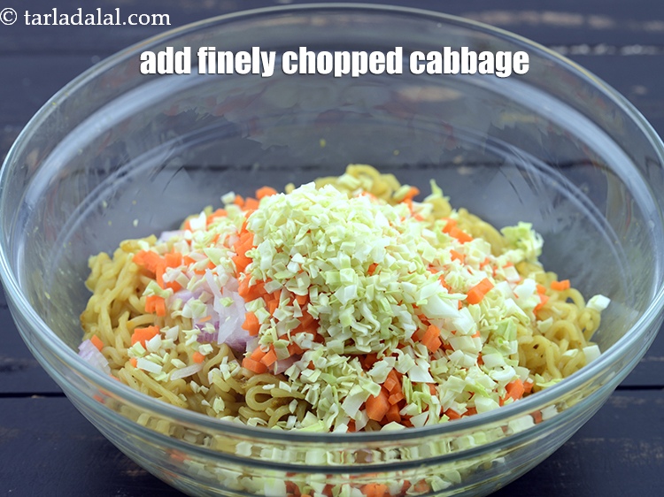 Step 11 – Add &frac14; cup finely&nbsp;<a href="https://www.tarladalal.com/glossary-chopped-cabbage-781i">chopped cabbage</a>.