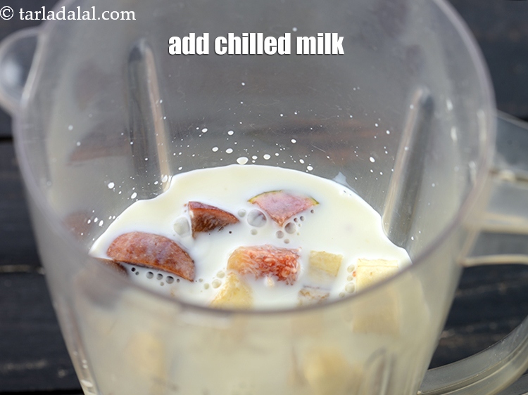 Step 10 – Add 1 1/4 cups chilled&nbsp;<a href="https://www.tarladalal.com/glossary-milk-doodh-full-cream-milk-514i">milk</a>.