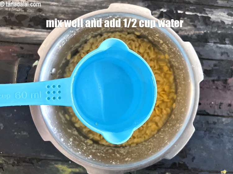 Step 10 – Mix well and add &frac12; cup of water.