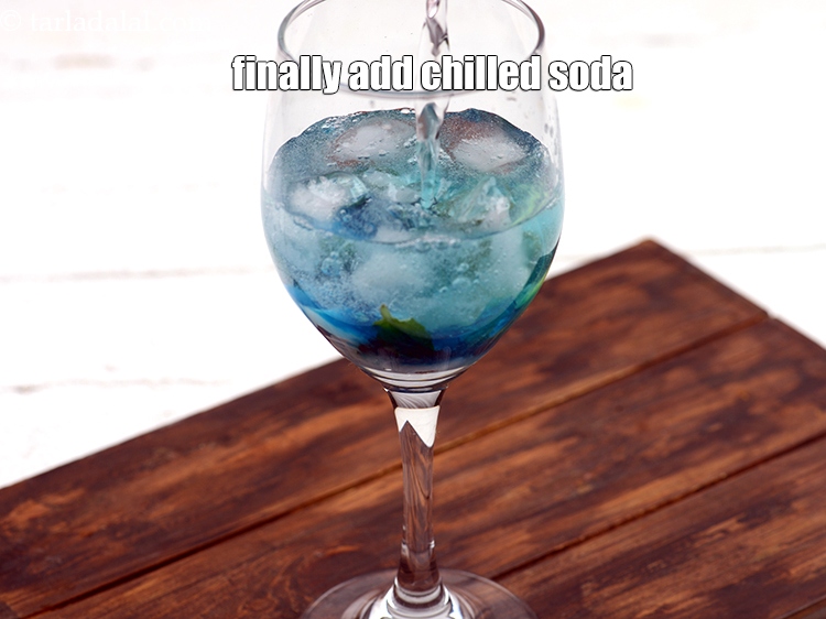 Step 10 – Finally add &frac34; cup chilled&nbsp;<a href="https://www.tarladalal.com/glossary-soda-club-water-614i">soda</a>.