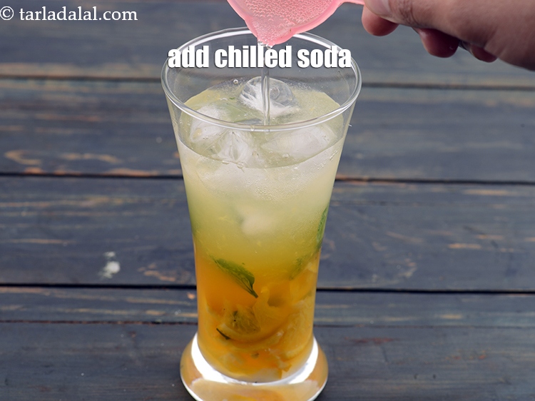Step 11 – Add &frac12; cup chilled&nbsp;<a href="https://www.tarladalal.com/glossary-soda-club-water-614i">soda</a>.