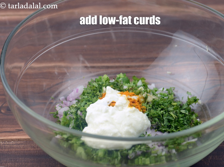 Step 10 – Add 1 tbsp&nbsp;<a href="https://www.tarladalal.com/glossary-low-fat-curds-low-cal-dahi-low-calorie-curd-low-fat-yogurt-1107i">low-fat curds (dahi)</a>.