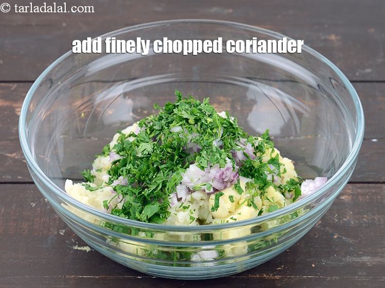 Step 11 – Add 2 tbsp&nbsp;finely&nbsp;<a href="https://www.tarladalal.com/glossary-chopped-coriander-783i">chopped coriander (dhania)</a>.