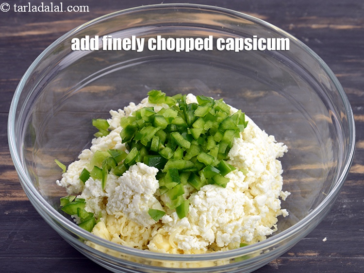 Step 11 – Add 1/4 cup finely <a href="https://www.tarladalal.com/glossary-chopped-capsicum-164i">chopped capsicum</a>.