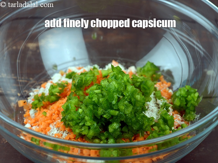 Step 10 – Add 1/4 cup&nbsp;finely&nbsp;<a href="https://www.tarladalal.com/glossary-chopped-capsicum-164i">chopped capsicum</a>.&nbsp;