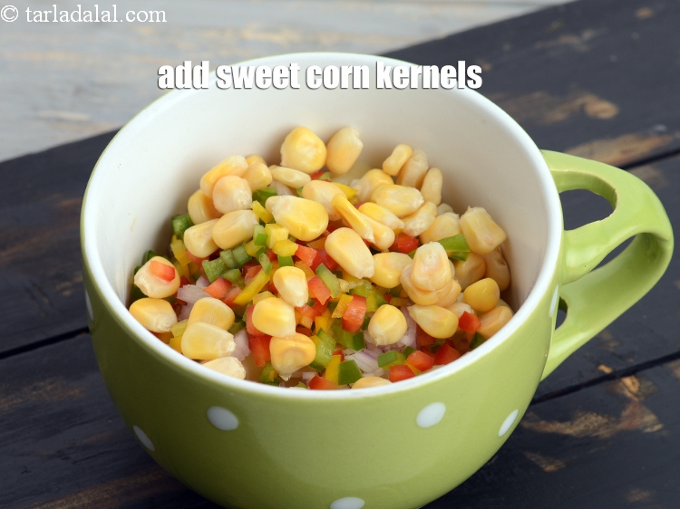 Step 10 – Add 1&frac12; tbsp <a href="https://www.tarladalal.com/glossary-sweet-corn-kernels-makai-ke-dane-156i">sweet corn kernels (makai ke dane)</a>.