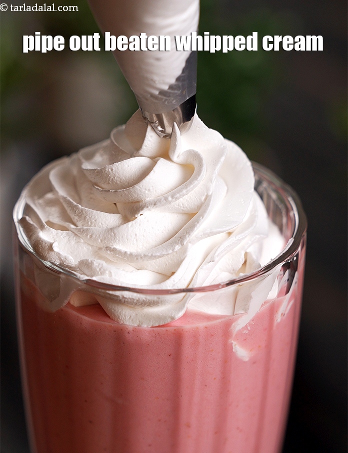 Step 10 – Pipe out <a href="https://www.tarladalal.com/glossary-beaten-whipped-cream-1948i">beaten whipped cream</a> evenly over the circumference of the glass.&nbsp;