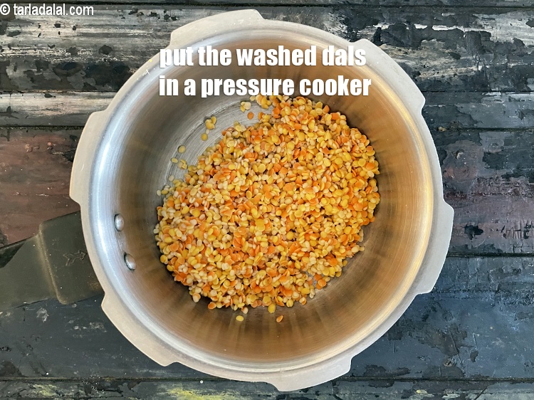 Step 10 – Put washed and drained dals in a pressure cooker.