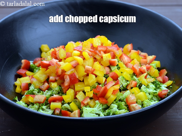 Step 11 – Add 1 cup&nbsp;chopped capsicum (<a href="https://www.tarladalal.com/glossary-chopped-red-capsicum-2299i">red</a>&nbsp;and&nbsp;<a href="https://www.tarladalal.com/glossary-chopped-yellow-capsicum-2300i">yellow</a>).