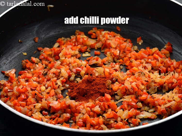 Step 10 – Add &frac12; tsp <a href="https://www.tarladalal.com/glossary-chilli-powder-red-chilli-powder-339i">chilli powder</a>.